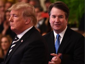 (FILES) In this file photo taken on October 08, 2018 US President Trump participates in the swearing-in ceremony of Brett Kavanaugh (R) as Associate Justice of the US Supreme Court at the White House in Washington, DC. - US President Donald Trump mounted an angry defense of Supreme Court Justice Brett Kavanaugh on September 15, 2019 as the controversial judge faced calls for an investigation over fresh allegations of sexual misconduct. Trump blasted the media and "Radical Left Democrats" after a former Yale classmate of Kavanaugh alleged that the jurist -- one of the most senior judges in the land -- exposed himself at a freshman year party before other students pushed his genitals into the hand of a female student.The latest allegation in the New York Times came after Kavanaugh denied sexual misconduct accusations leveled against him by two women during his confirmation to the Supreme Court last October.