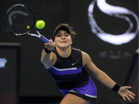 Bianca Andreescu of Canada hits a return during her women's singles quarter-final match against Naomi Osaka of Japan at the China Open tennis tournament in Beijing on October 4, 2019.