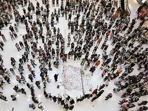 Pro-democracy protesters gather in a shopping mall in the Sha Tin district in Hong Kong on Monday.