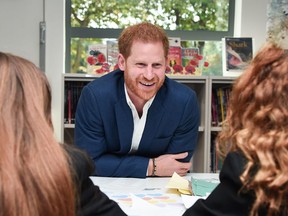 Britain's Prince Harry, Duke of Sussex, meets students during a visit to Nottingham Academy on October 10, 2019 in Nottingham, central England to mark World Mental Health Day.