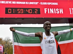 Kenya's Eliud Kipchoge celebrates after busting the mythical two-hour barrier for the marathon on October 12 2019 in Vienna. Photo by HERBERT NEUBAUER / APA / AFP) / Austria OUT (Photo by HERBERT NEUBAUER/APA/AFP via Getty Images