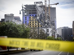 The Hard Rock Hotel partially collapsed onto Canal Street downtown New Orleans, Louisiana on Oct. 12, 2019. (EMILY KASK/30238387A /AFP via Getty Images)