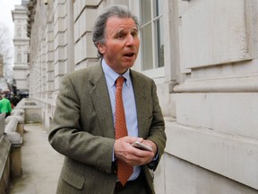 (FILES) In this file photo taken on March 22, 2019 Conservative MP Oliver Letwin arrives at the Cabinet Office on Whitehall in London on March 22, 2019. - Oliver Letwin, who forced Prime Minister Boris Johnson to accept another possible Brexit delay, is a policy guru who has been quietly wielding political influence since the 1980s. A 63-year-old intellectual with a silver shock of hair and piercing eyes, Letwin has been waging a campaign against a chaotic "no-deal" divorce with the EU.