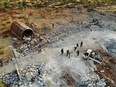 An aerial view taken on October 27, 2019 shows the site that was hit by helicopter gunfire which reportedly killed nine people near the northwestern Syrian village of Barisha in the Idlib province along the border with Turkey, where "groups linked to the Islamic State (IS) group" were present, according to a Britain-based war monitor with sources inside Syria.