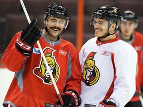 Chris Phillips, left, and Mark Borowiecki share a laugh at practice in November 2013. Borowiecki said Phillips 'deserves every recognition that could possibly be bestowed upon him as a hockey player.'