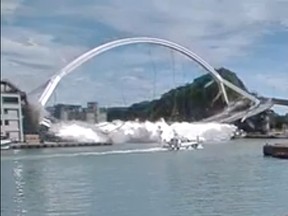 Nanfang'ao Bridge is seen collapsing in Suao, Taiwan Oct. 1, 2019, in this still image taken from a video.