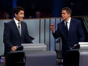 Liberal leader Justin Trudeau and Conservative leader Andrew Scheer face off in the leaders French language debate in Gatineau on Oct. 10. Here’s a bold claim: politicians aren’t solely to blame for the divisive, oppositional rhetoric we've been hearing during this campaign.