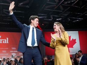 Liberal leader and Canadian Prime Minister Justin Trudeau and his wife Sophie Gregoire Trudeau wave to supporters after the federal election at the Palais des Congres in Montreal, Quebec, Canada October 22, 2019.