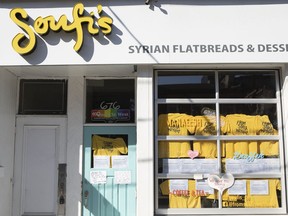 Notices of closure are taped to the window of Soufi's restaurant in Toronto on Wednesday, October 10, 2019. The eatery owned by a Syrian family announced yesterday that it is shutting down after receiving death threats, a week after a relative was involved in an incident involving a senior at a Maxime Bernier event in Hamilton on September 29, 2019.