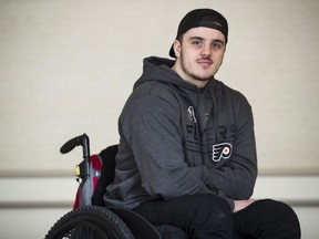 Ryan Straschnitzki poses for a photograph in Philadelphia, Wednesday, March 20, 2019. Straschnitzki will depart on a 12,000 kilometre journey to Thailand later this week for a medical procedure that could help restore some movement after being paralyzed in the Humboldt Broncos bus crash.