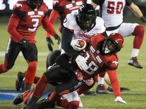 Ottawa Redblacks' Chris Ackie (5) tackles The Calgary Stampeders' Terry Williams (38) in Edmonton, November 25, 2018. Ackie was acquired in a last-minute deal last season.