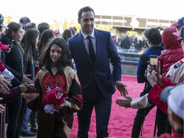 Colin White greets fans as he walks the red carpet.