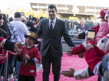 Dylan DeMelo greets fans as he walks the red carpet.