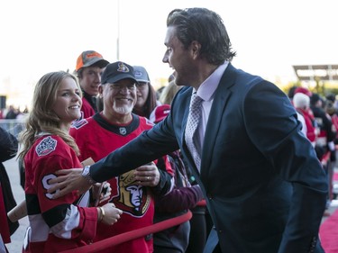 Bobby Ryan greets fans Jerry Popowich and Ellie Popowich as he walks the red carpet entering the Canadian Tire Centre for the home opener.