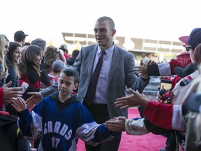 Mark Borowiecki greets fans as he walks the red carpet entering the Canadian Tire Centre for the home opener against the New York Rangers.