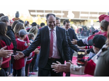 General manager Pierre Dorion greets fans as he walks the red carpet.