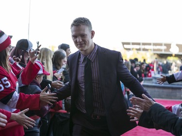 Ottawa Senators Brady Tkachuk greets fans as he walks the red carpet entering the Canadian Tire Centre for the teams home opener against the New York Rangers. October 5, 2019. Errol McGihon/Postmedia