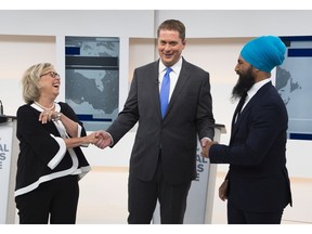 Conservative leader Andrew Scheer, centre, is flanked by Green party leader Elizabeth May (l), and NDP Leader Jagmeet Singh (r) during the Maclean's/Citytv debate in early September.