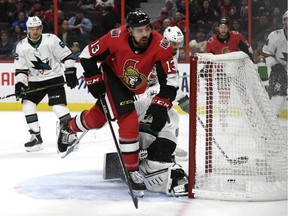 Ottawa Senators left wing Nick Paul  skates away from San Jose Sharks goaltender Aaron Dell after scoring a goal in Ottawa, Sunday night.