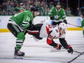 Senators centre Vladislav Namestnikov (90) is tripped by Stars centre Jason Dickinson during the third period of Monday's game in Dallas.