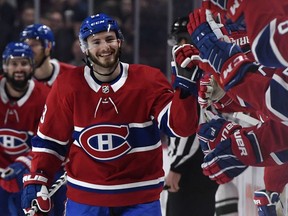 Oct 17, 2019; Montreal, Quebec, CAN; Montreal Canadiens defenseman Victor Mete (53) reacts with teammates after scoring a goal against the Minnesota Wild during the first period at the Bell Centre. It is Mete first NHL goal. Mandatory Credit: Eric Bolte-USA TODAY Sports ORG XMIT: USATSI-405092