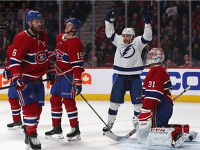 Oct 15, 2019; Montreal, Quebec, CAN; Tampa Bay Lightning center Brayden Point (21) celebrates a defenseman Braydon Coburn (55) (not pictured) goal against Montreal Canadiens goaltender Carey Price (31) during the first period at the Bell Centre.