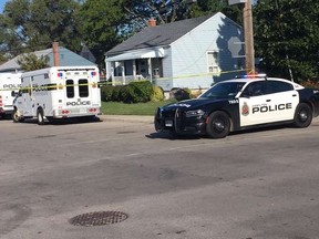 Cops search the scene a day after a fatal stabbing of a 14-year-old boy, Tuesday, Oct. 8, 2019. (Brad Hunter/Postmedia)