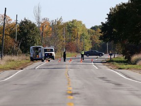 Kingston Police investigate the scene of a hit-and-run collision on Highway 2 near Joyceville Road that sent a pedestrian to hospital with serious injuries on Friday morning. Police are looking for a white GMC or Chevrolet cargo van with damage to the front end. (Elliot Ferguson/The Whig-Standard)