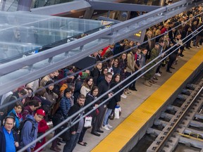 Commuters at the Tunney's Pasture Station await their train on Monday October 7, 2019.