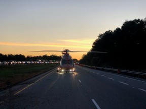 An Ornge air ambulance sets down near a multi-vehicle crash on Highway 401.