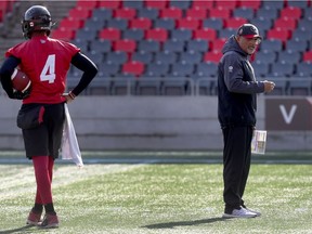 Ottawa Redblacks assistant coach Joe Paopao, right, during practice on Tuesday.