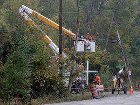 Ottawa Hydro workers were busy making repairs off of Anderson Road in Ottawa Tuesday Oct 1, 2019. Downed hydro poles were expected to keep Anderson road between Renaud Road and Ridge Road closed throughout the morning commute Tuesday. A number of poles were toppled overnight by a passing truck that clipped some wires, Tony Caldwell