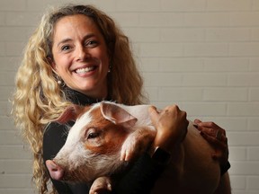 Lara Elizabeth Cohen and her buddy Mango the pig in Ottawa Friday Oct 11, 2019. Mango was found on the side of the road and Lara is a vet who has been helping Mango get healthy once again.