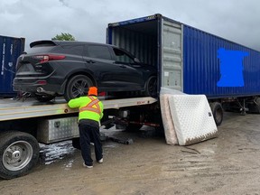 Police remove stolen vehicle from sea container