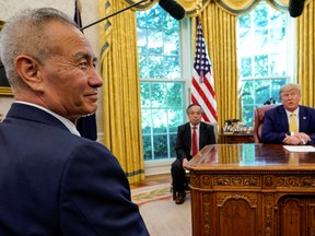 China's Vice Premier Liu He looks on during a meeting with U.S. President Donald Trump in the Oval Office of the White House in Washington, U.S., October 11, 2019.