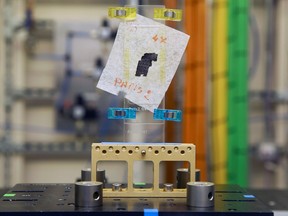 A piece of Herculaneum scroll is pictured in the experimental hutch area after recently being scanned, at Diamond Light Source in Didcot, west of London on September 30, 2019.