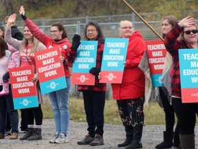 Members of the Elementary Teachers' Federation of Ontario protested during Premier Doug Ford's visit to Kenora on Wednesday, Oct. 16. Many teachers' union have criticized the goverment over potential job cuts and classroom size increases.