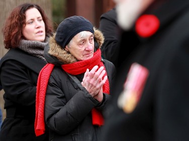 Hundreds of people clap as the veterans make their way past the Manotick Cenotaph for Remembrance Day Monday (Nov. 11, 2019).