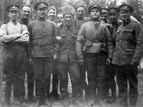 Gunners of the 68th Battery, R.C.A. with prisoners, Northern Russia.   ca. May 1919.