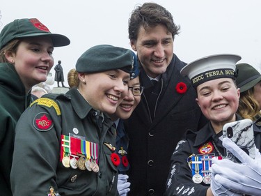 Prime Minister Justin Trudeau has his photo taken with a group of cadets following Remembrance Day ceremonies at the National War Memorial in Ottawa. November 11, 2019.