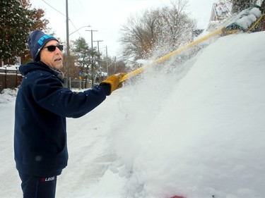 Frank Panareo not only cleared his neighbours sidewalks Tuesday, but also cleared off some of their cars along Patterson Avenue in the Glebe after the wallop of snow overnight.