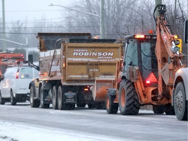 The wallop of snow overnight brought out the snowplows and left Ottawans shovelling and digging out their cars Tuesday morning.