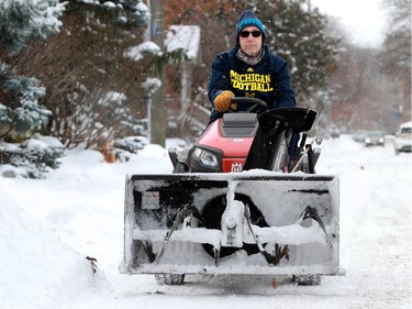 Frank Panareo not only cleared his neighbours sidewalks Tuesday, but also cleared off some of their cars along Patterson Avenue in the Glebe after the wallop of snow overnight.