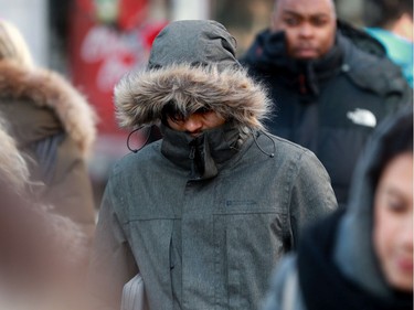 People in downtown Ottawa were not only bundling up, but covering their faces in an attempt to keep warm Wednesday as temperatures hit record lows in the city.