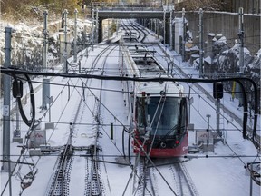 A light rail train pulls out of Tunney's Pasture station after the first significant snowfall of the season earlier this week.