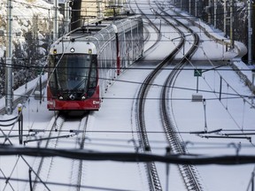 A LRT train makes its way towards Tunney's Pasture Station in Ottawa after the first significant snowfall of the season. November 12, 2019.