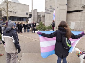 More than 50 people gather at Brantford city hall Monday afternoon for the raising of the transgender flag, recognizing Transgender Awareness Week in the city.