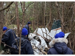Transportion Safety Board investigators at the scene of a fatal plane crash off Creekford Road in Kingston on Thursday, Nov. 28, 2019.