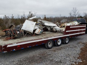 The wreckage of the Piper PA32 that crashed in Kingston on Wednesday was transported on Friday to the Transportation Safety Board's Richmond Hill office for further examination. Seven people died in the crash.