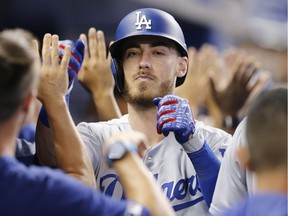 Cody Bellinger of the Los Angeles Dodgers celebrates with teammates after hitting a home run in August 2019.